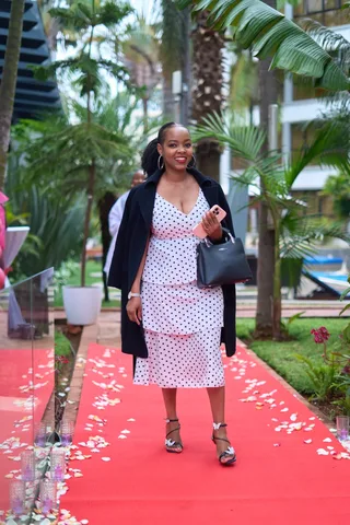 A guest arriving on the pink carpet